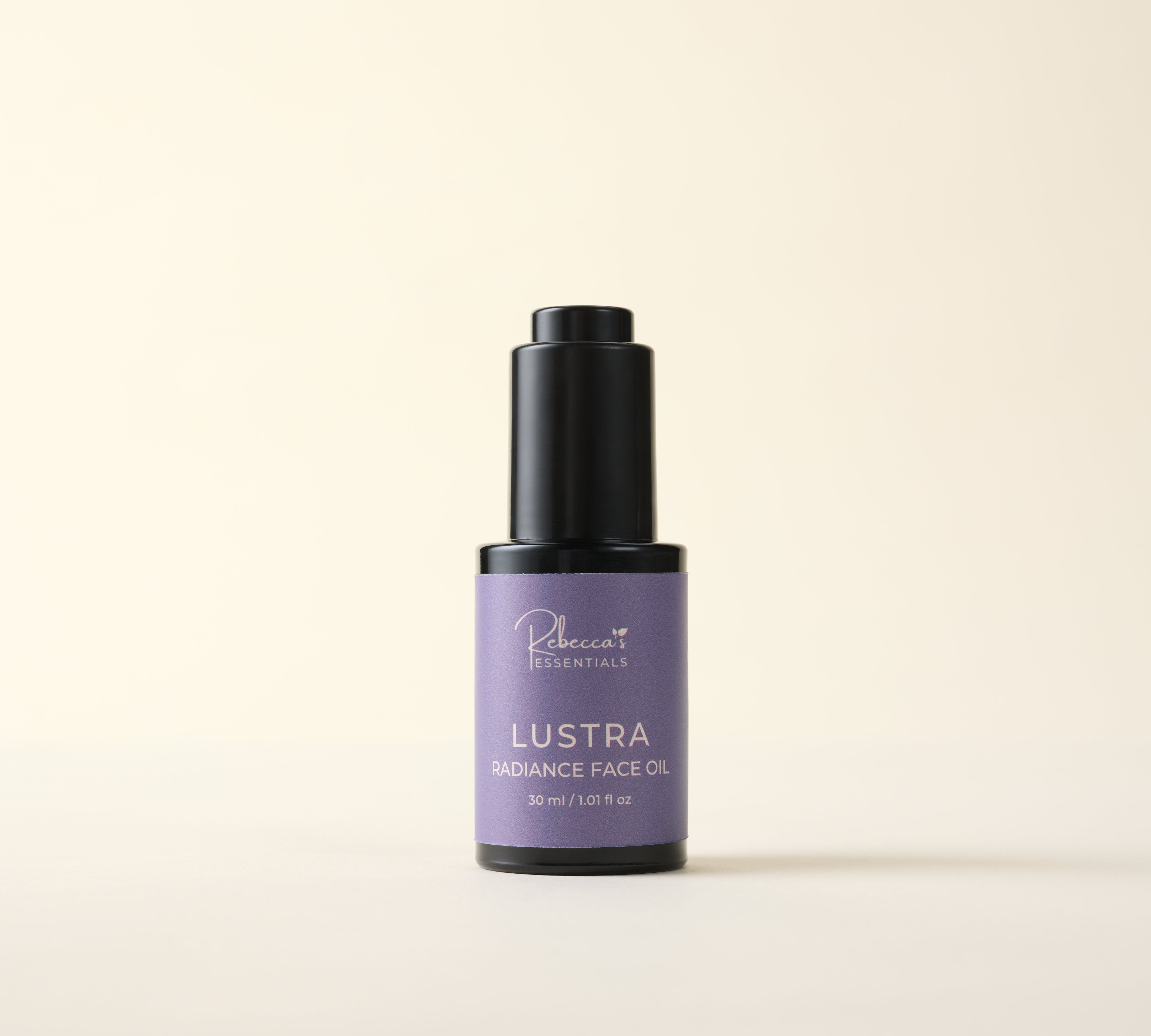 Bottle of Lustra Radiance Face Oil on a beige background