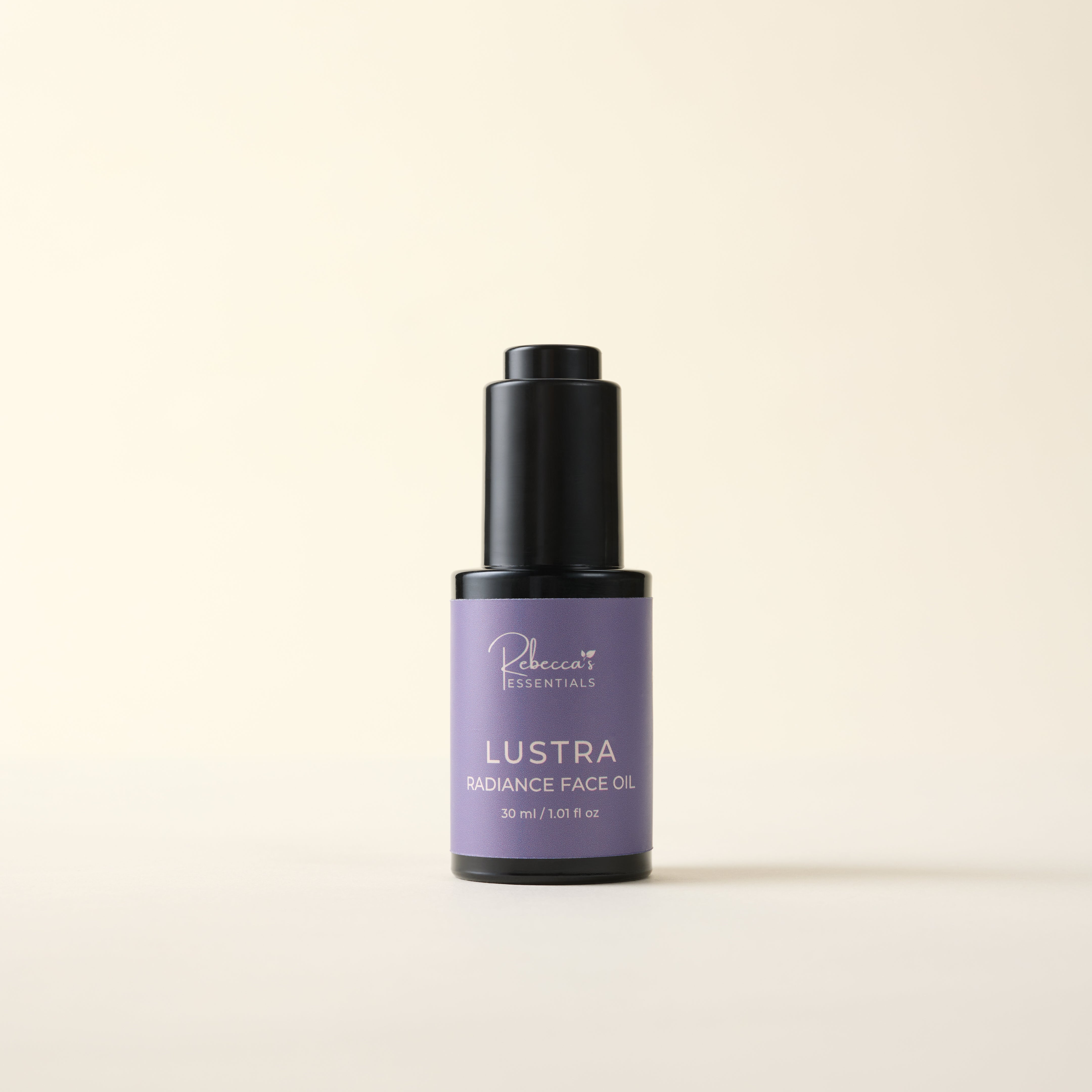 Bottle of Lustra Radiance Face Oil on a beige background
