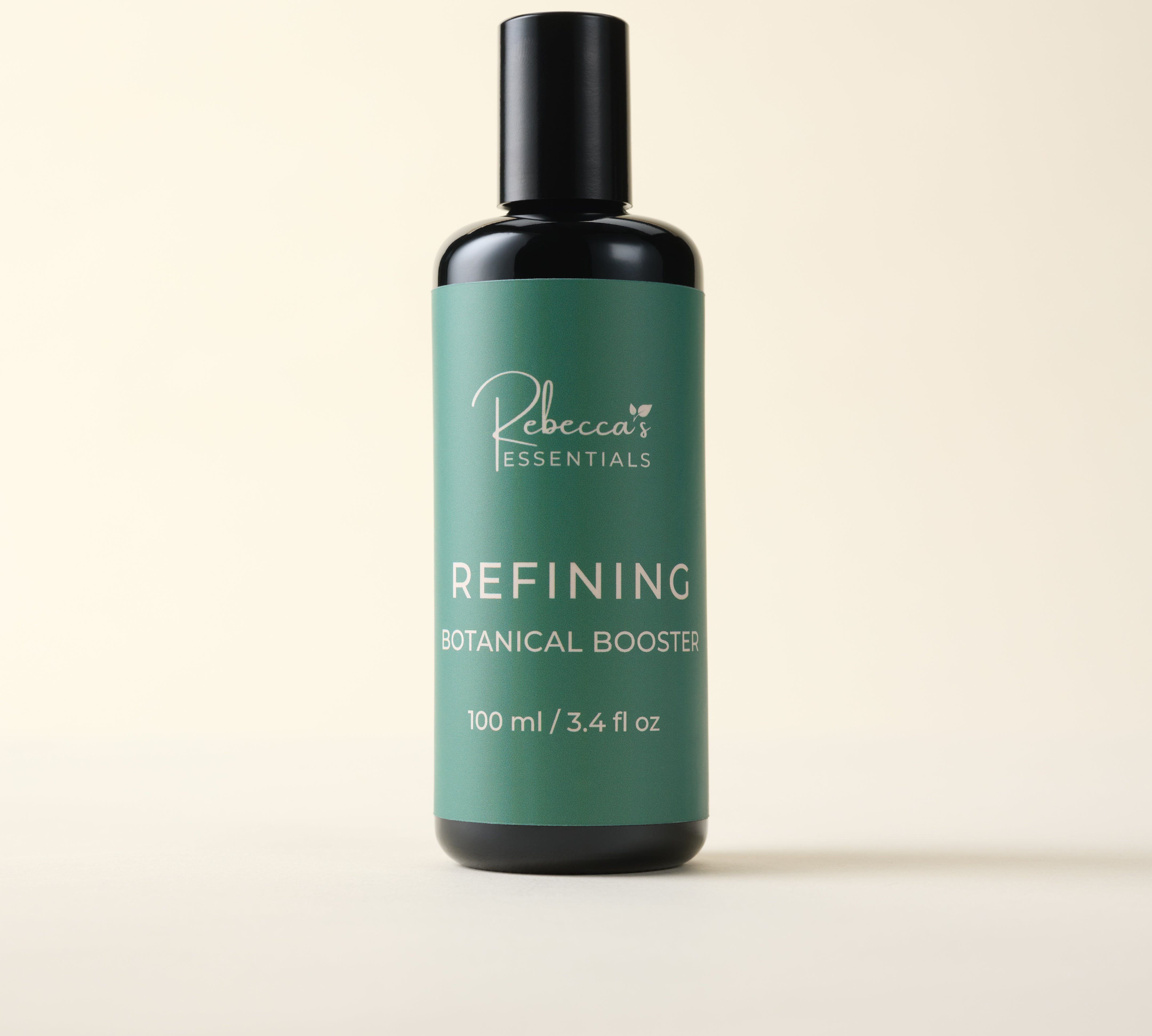 Bottle of 'Rebecca's Essentials Refining Botanical Booster' on a beige background